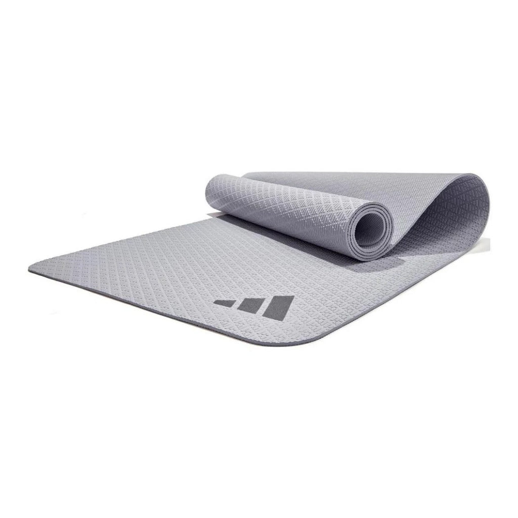 Gray yoga mat with Adidas logo on a white background