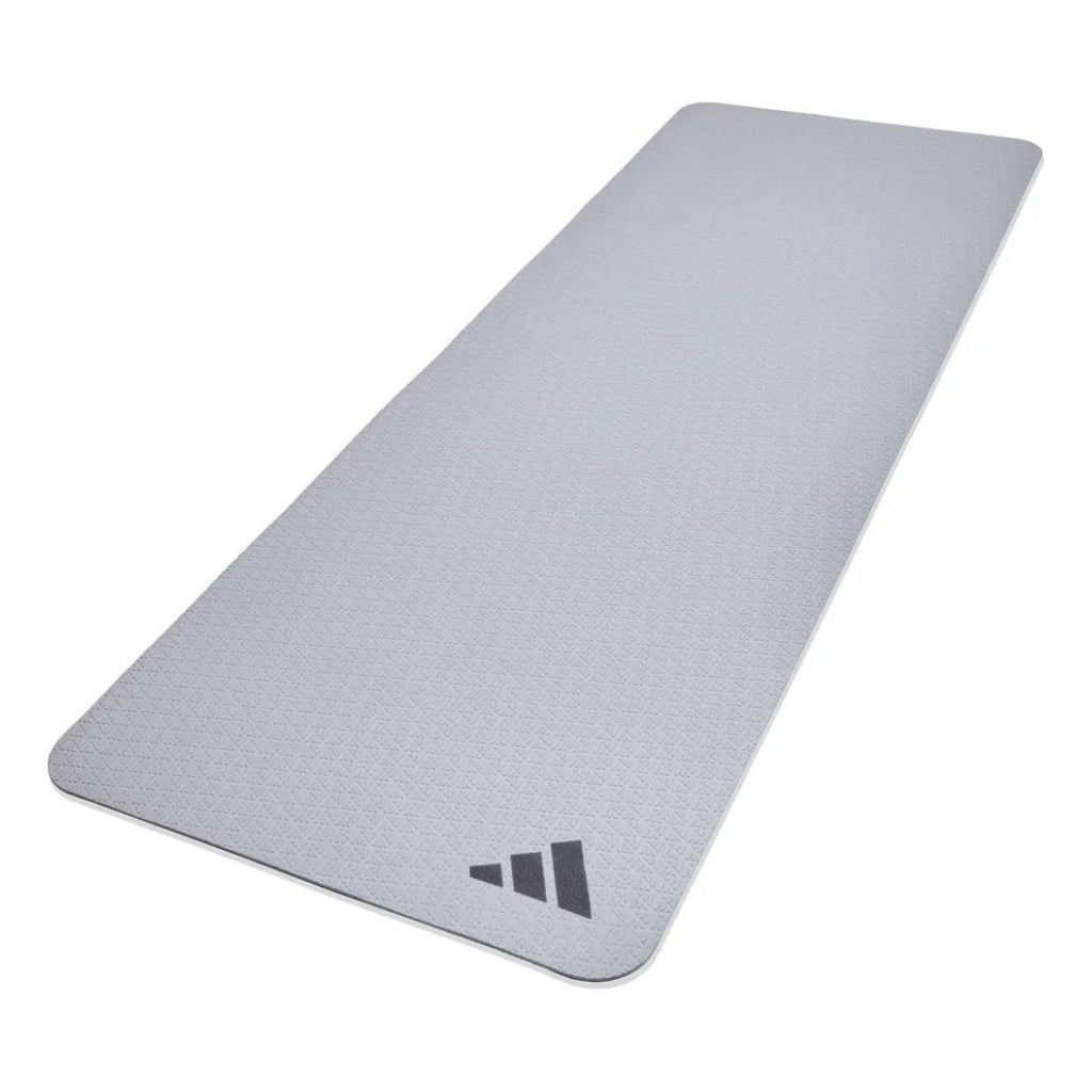 A grey Adidas yoga mat