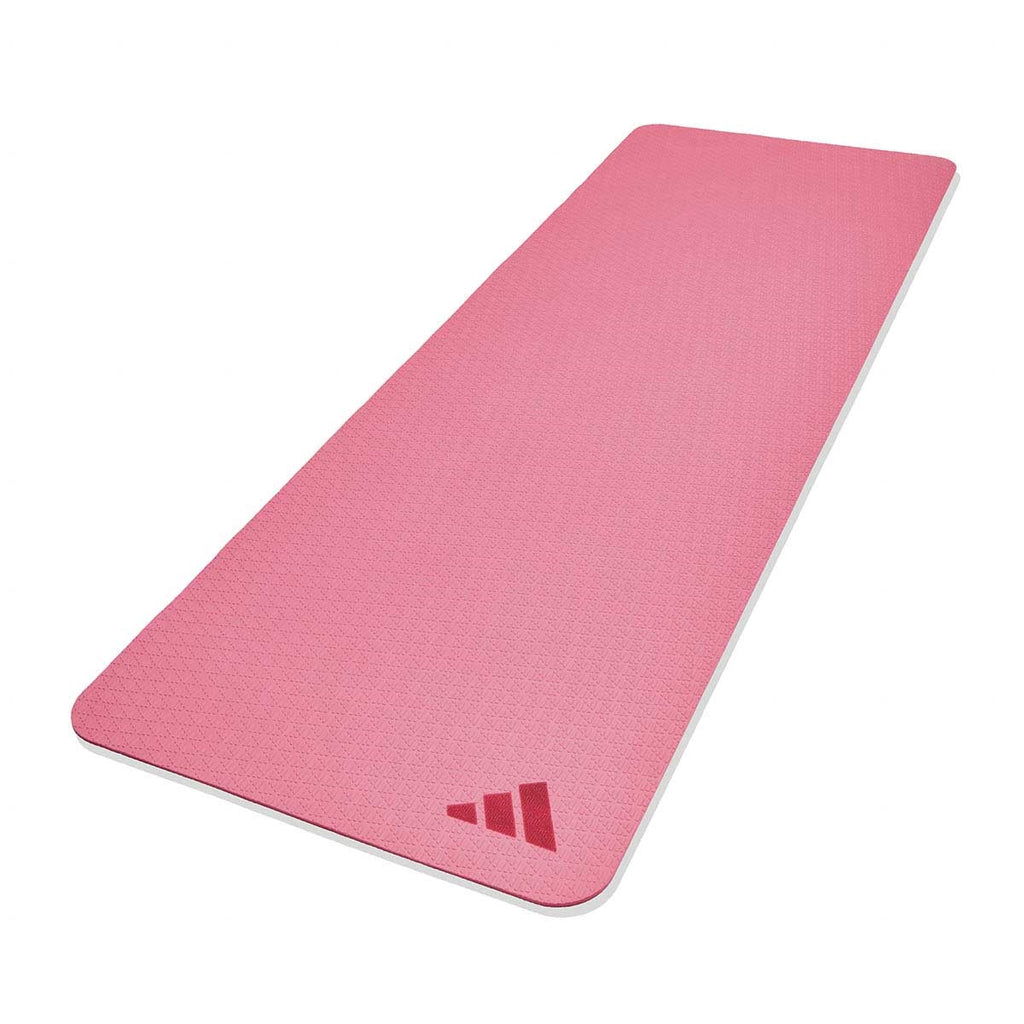 A pink Adidas yoga mat